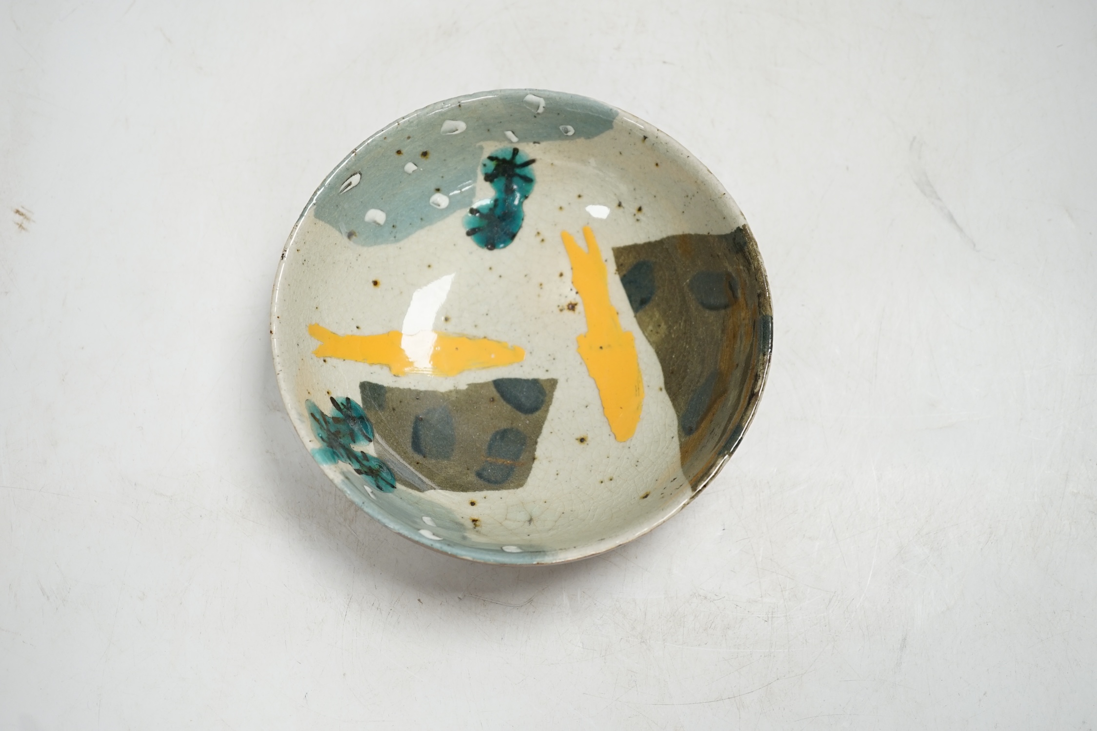 John Maltby (1936-2020), a studio pottery bowl decorated with yellow fish, 16cm. Condition - good
